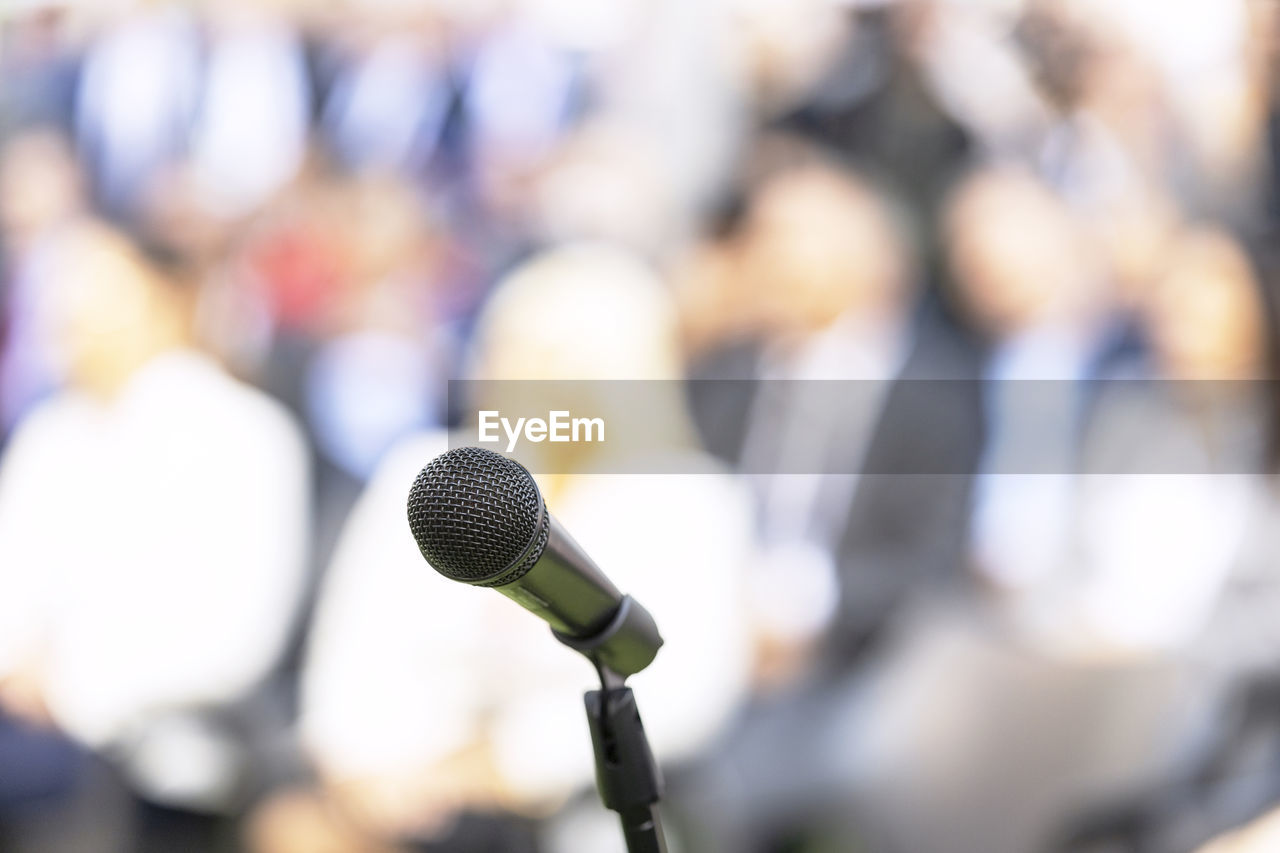 Business conference event, corporate presentation or workshop, microphone in the focus