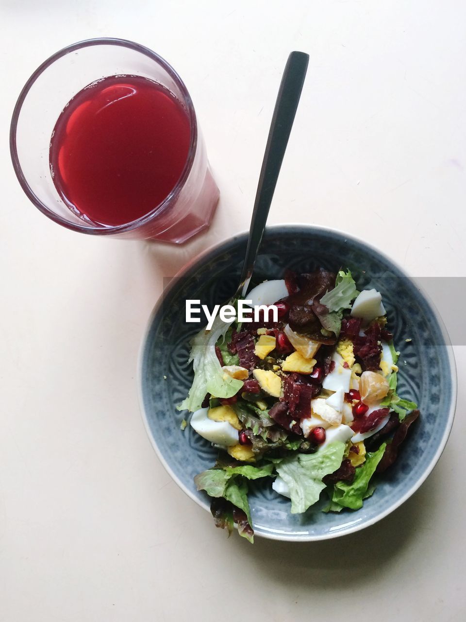 Directly above shot of salad and drink on table