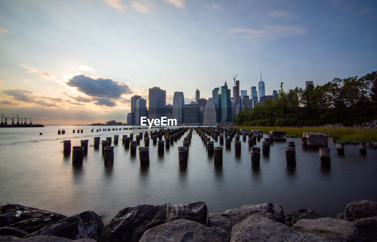 Panoramic view of sea and buildings against sky