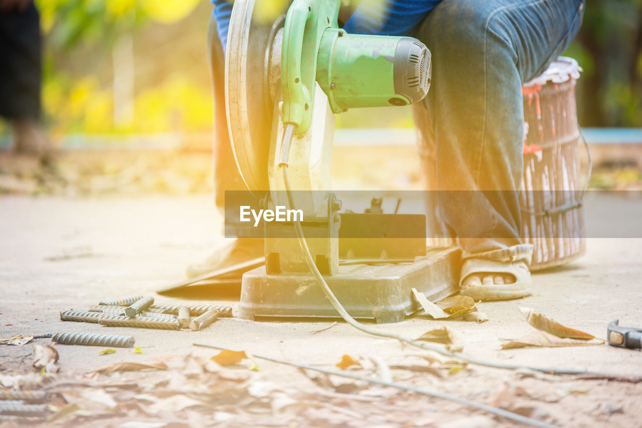 Low section of man working outdoors