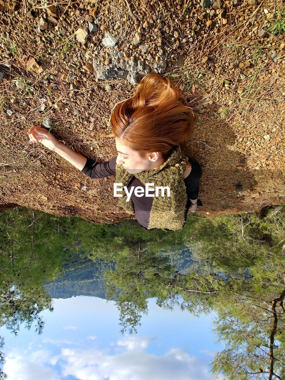 High angle view of woman on plants / woman on ground / woman in the forest