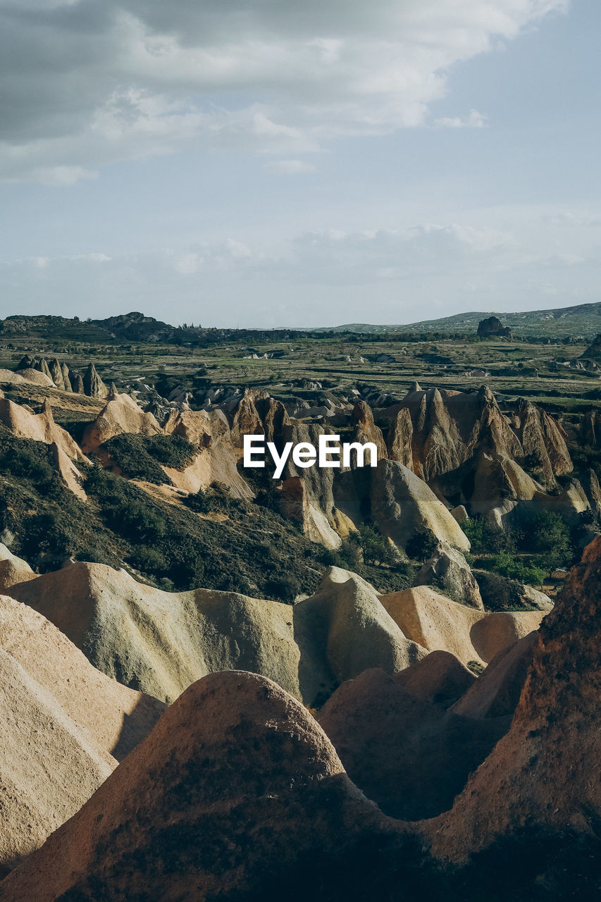 Panoramic view of landscape against cloudy sky