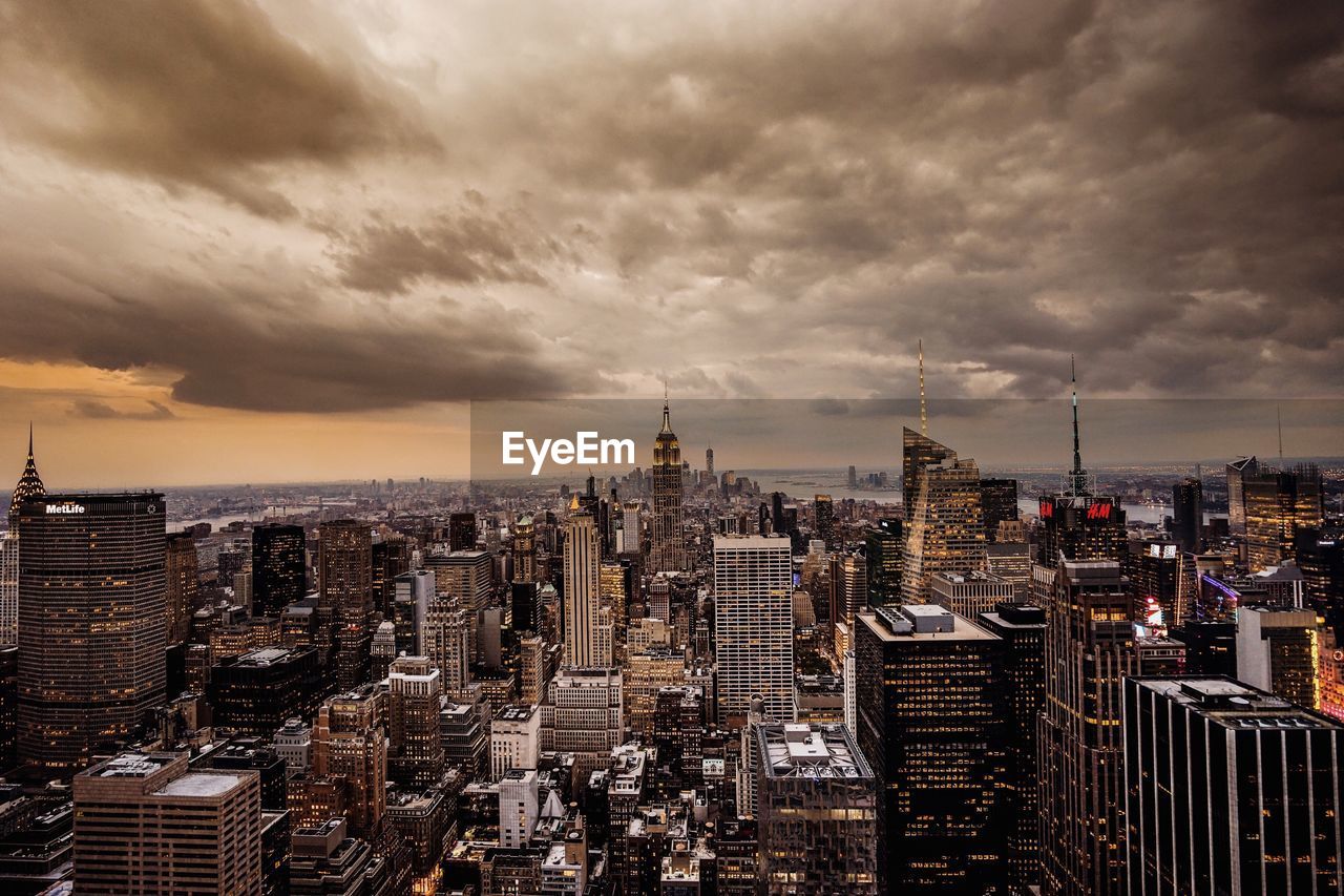 CITYSCAPE AGAINST CLOUDY SKY