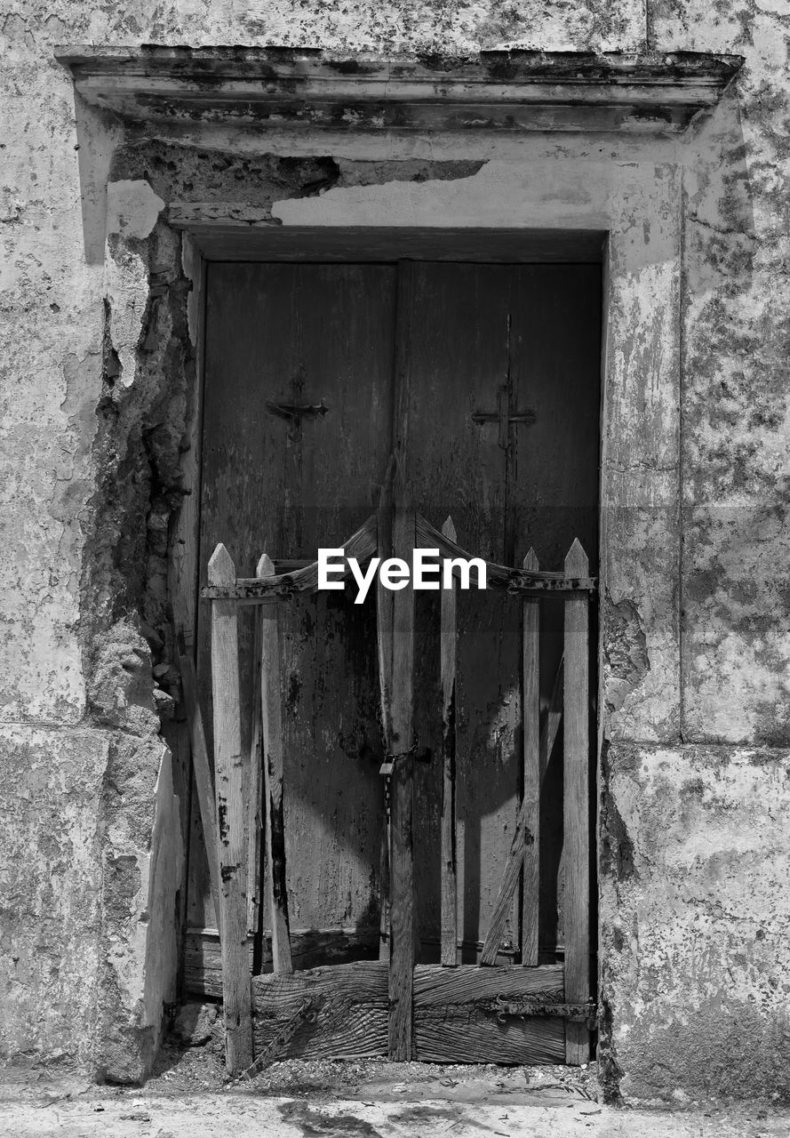 Old weathered door of house