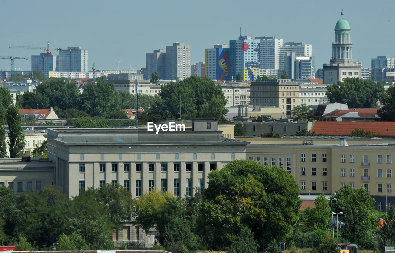 BUILDINGS AGAINST CLEAR SKY