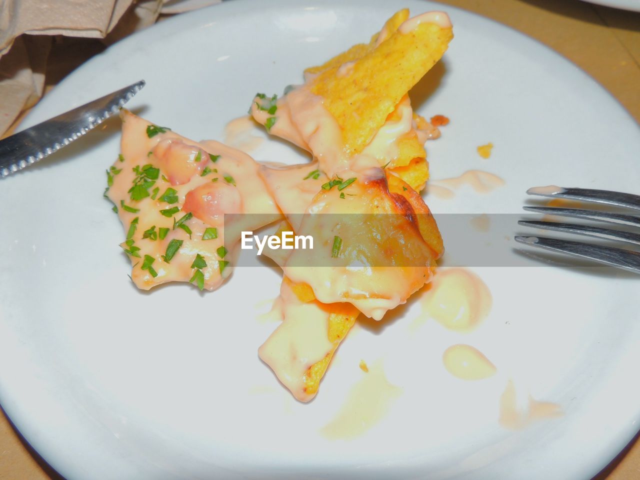 Close-up of nachos served in plate on table