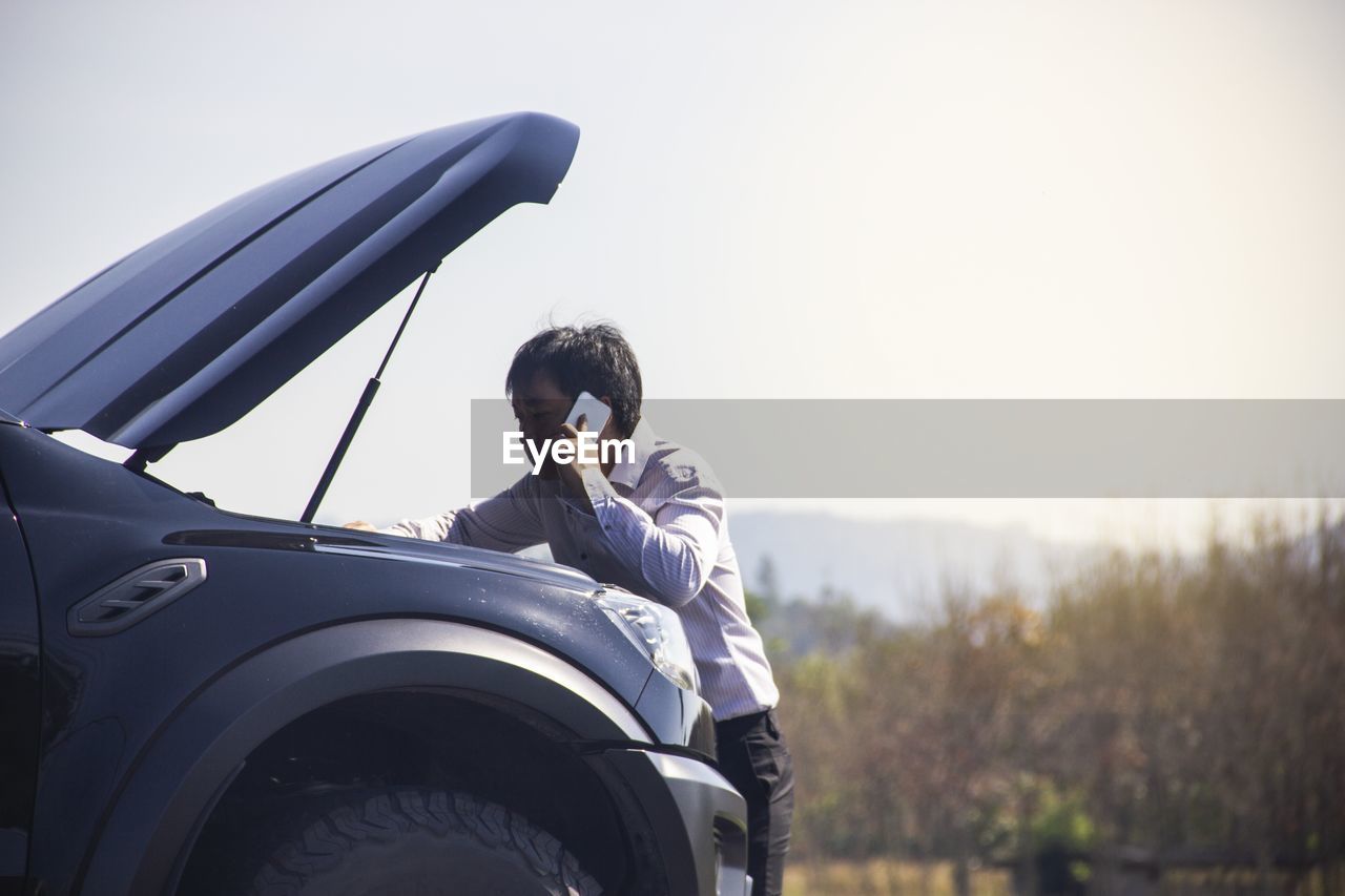 MAN SITTING IN CAR