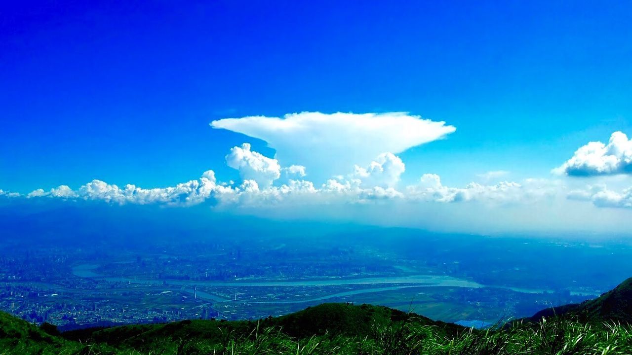 Idyllic shot of landscape against blue sky