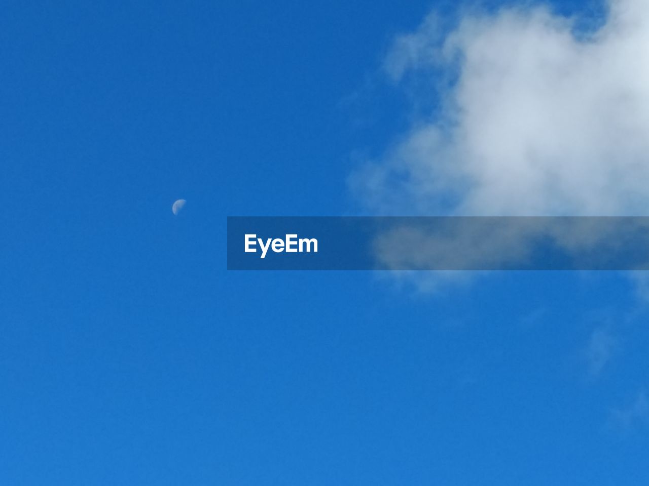 LOW ANGLE VIEW OF BLUE SKY AND MOON