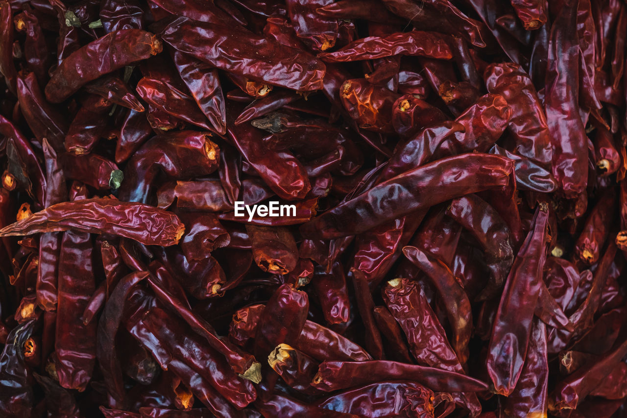 FULL FRAME SHOT OF RED CHILI PEPPERS AT MARKET