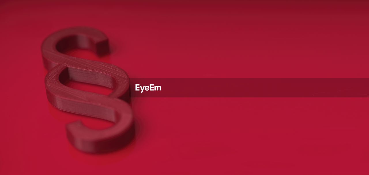 High angle view of text on red background