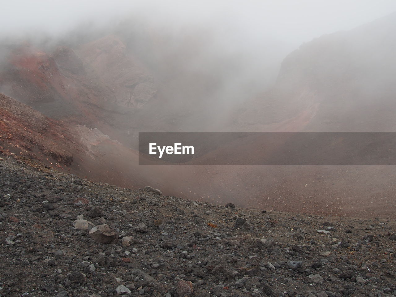 Scenic view of volcano during foggy weather