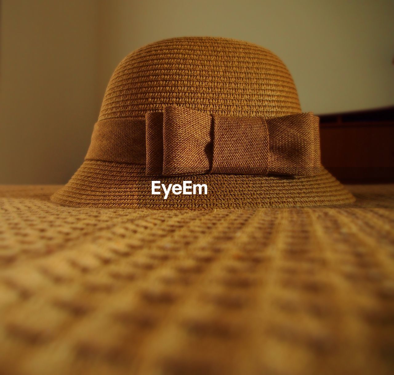 Close-up of straw hat on table