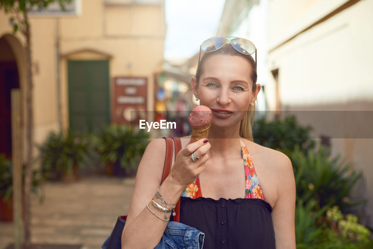 Portrait of mature woman eating ice cream