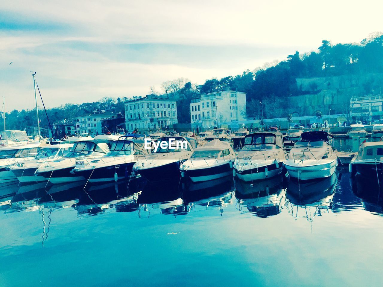 BOATS MOORED IN HARBOR