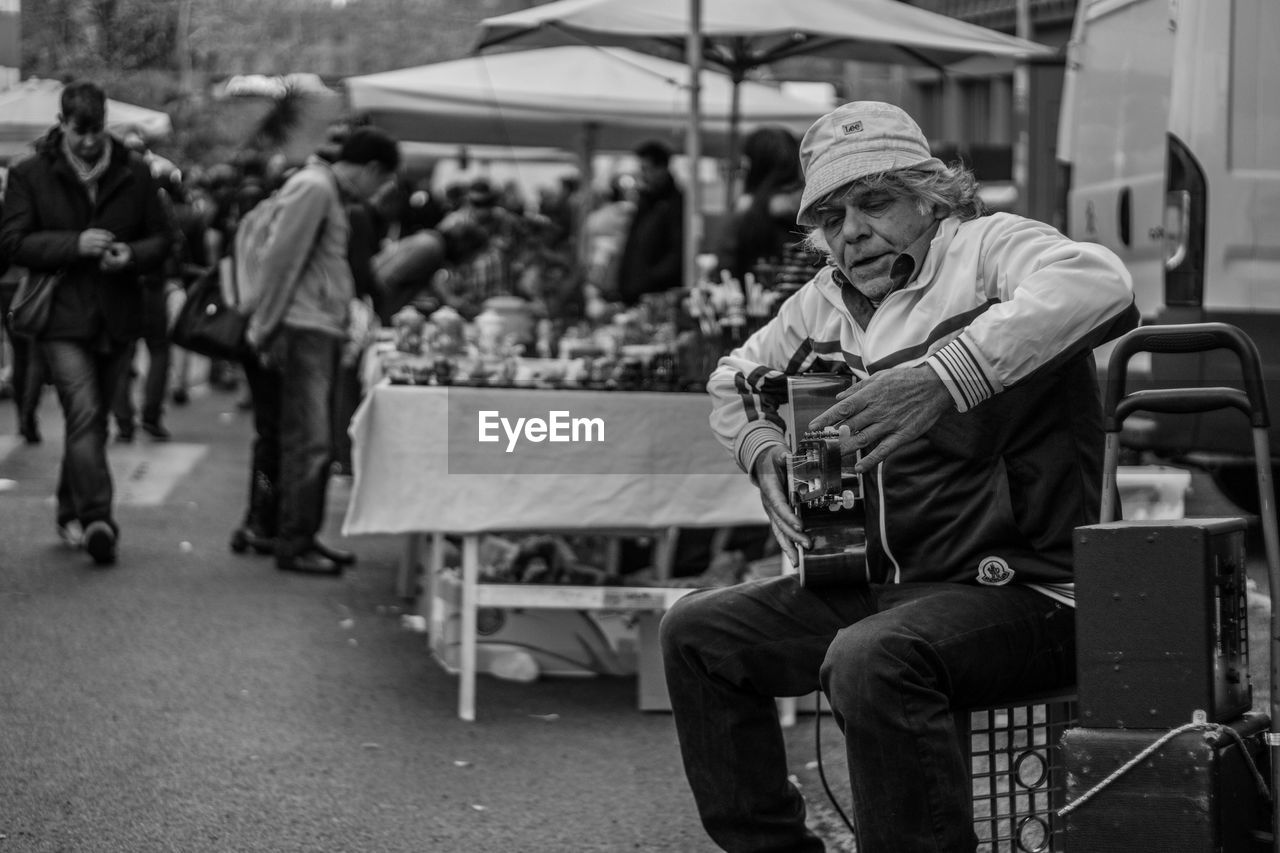 MAN STANDING IN CITY