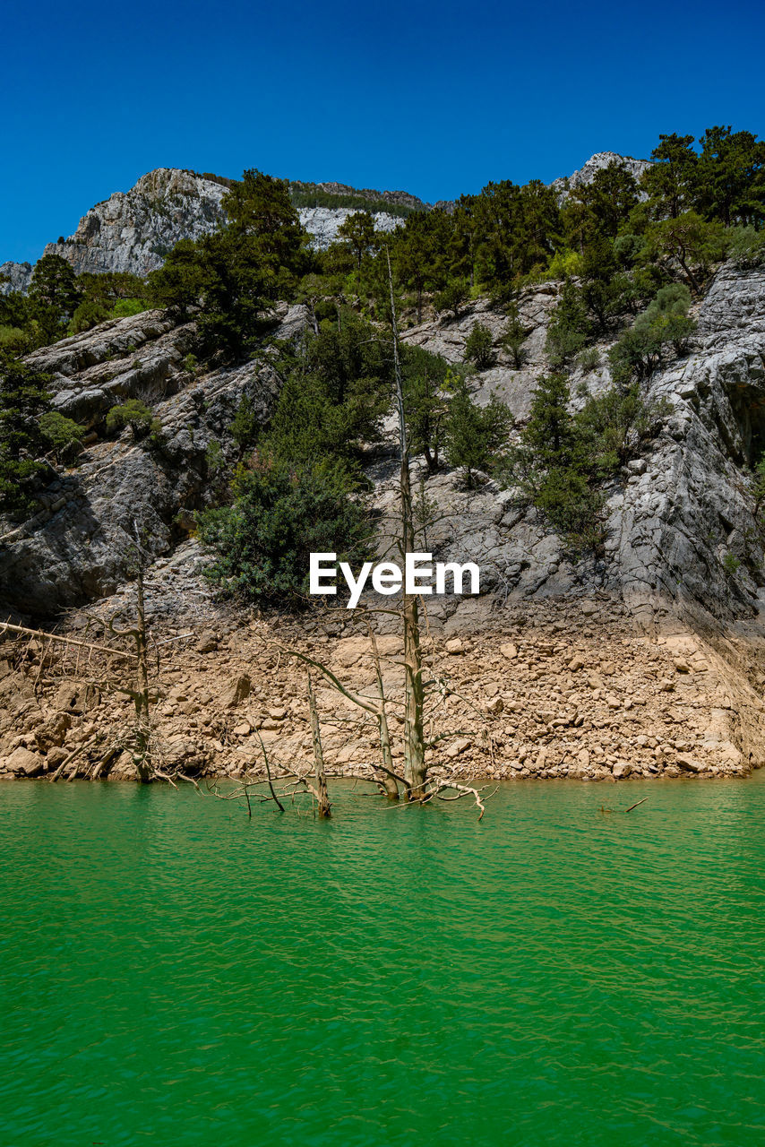 scenic view of lake against mountain