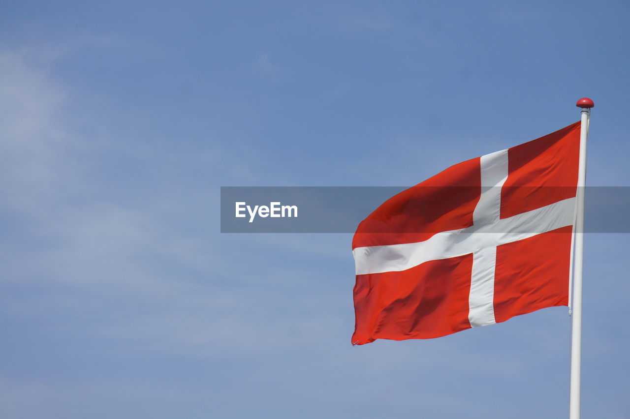 Low angle view of flag against sky