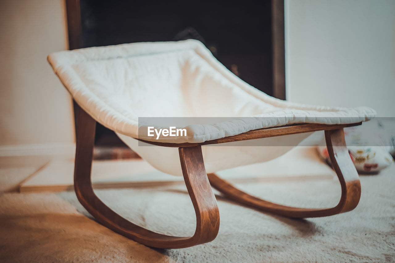 Close-up of empty chair at home