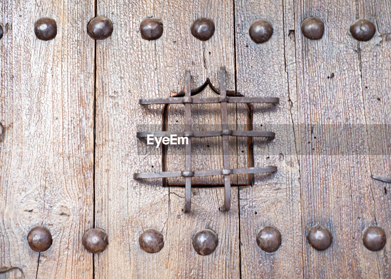 wood, door, entrance, metal, no people, backgrounds, iron, close-up, full frame, closed, pattern, security, protection, old, textured, rusty, wall, door knocker, knob, lock, day, weathered, handle, brown, shape