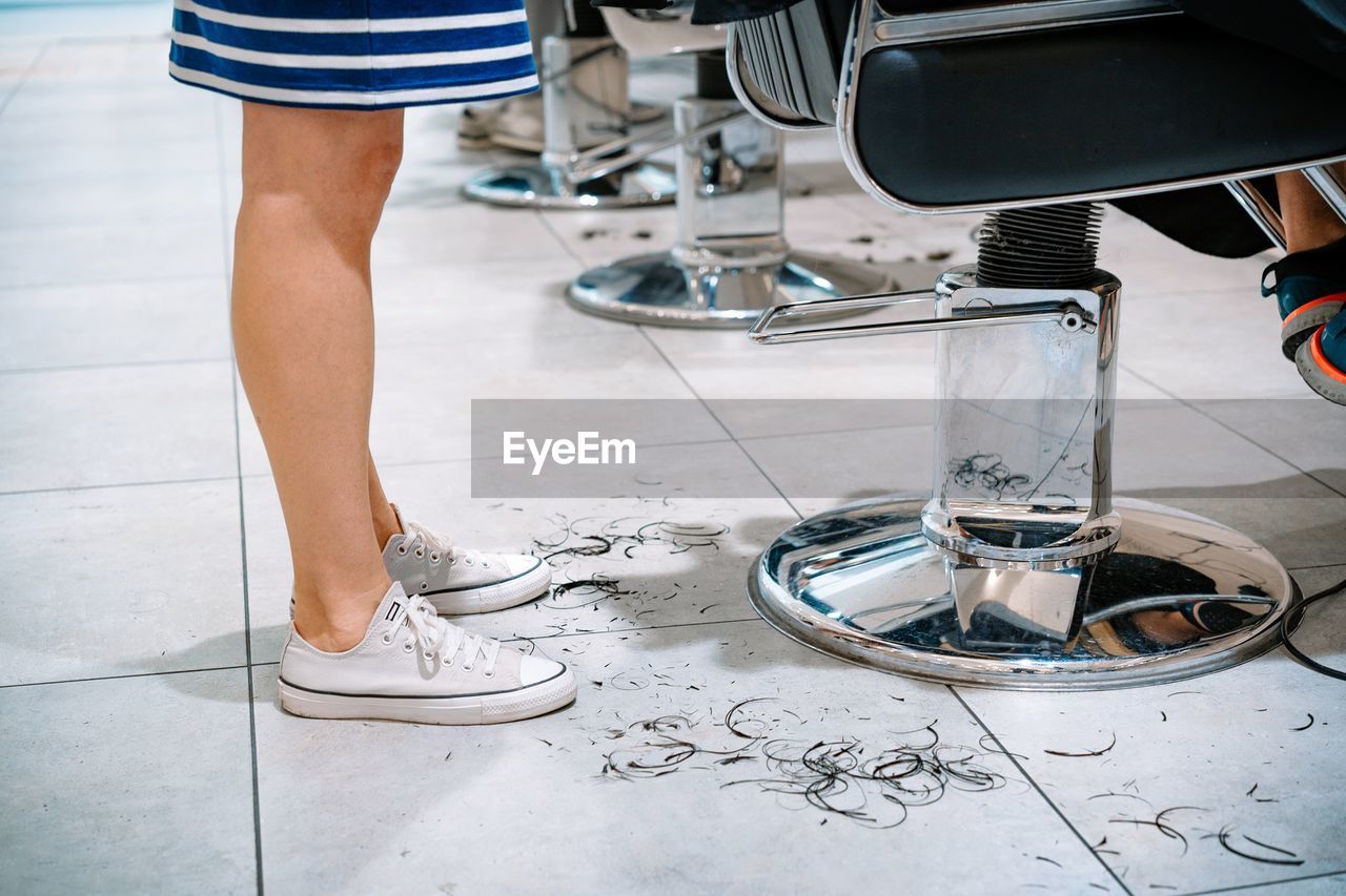 Hairdresser and customer at hair salon