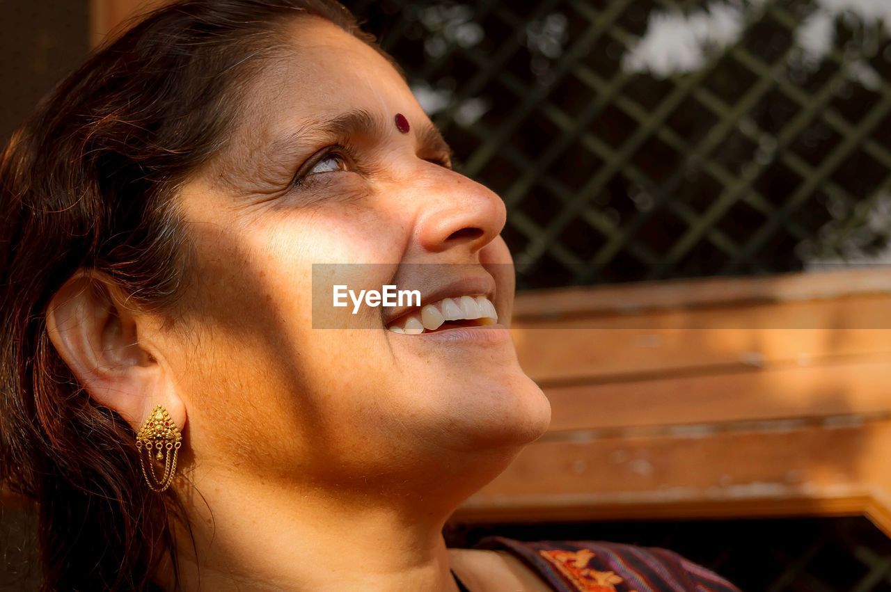 Close-up of mature woman looking away