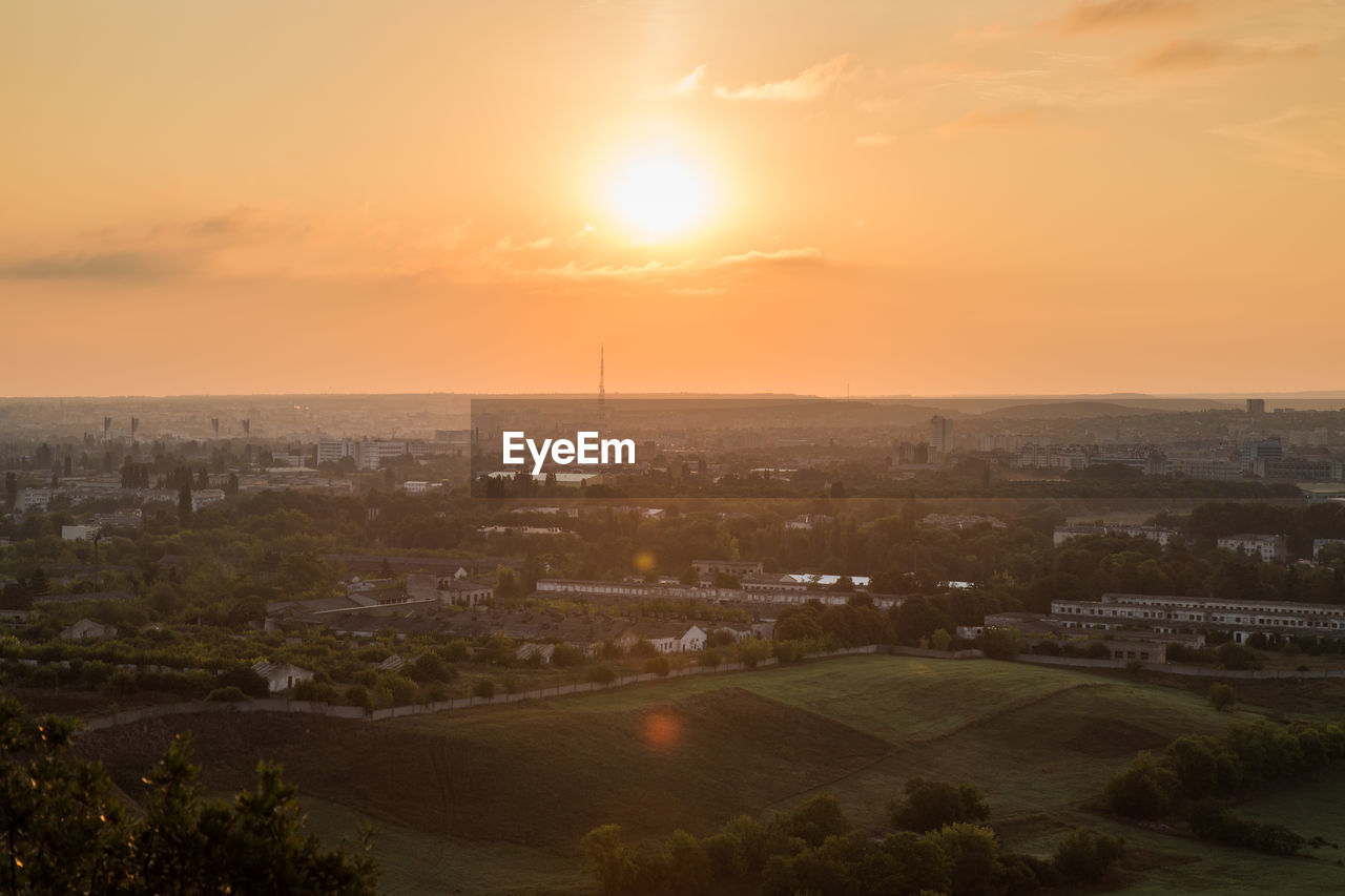 High angle view of townscape against sky during sunset