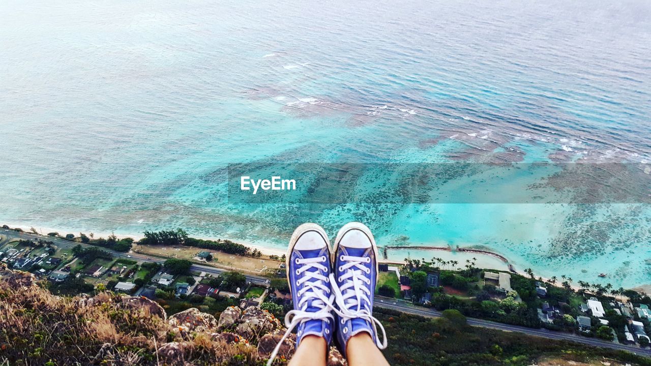 Low section of woman at deadmans catwalk over sea