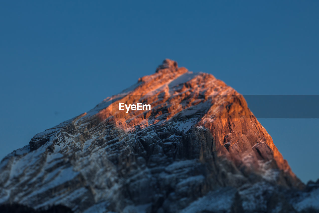 Low angle view of rock formations against sky