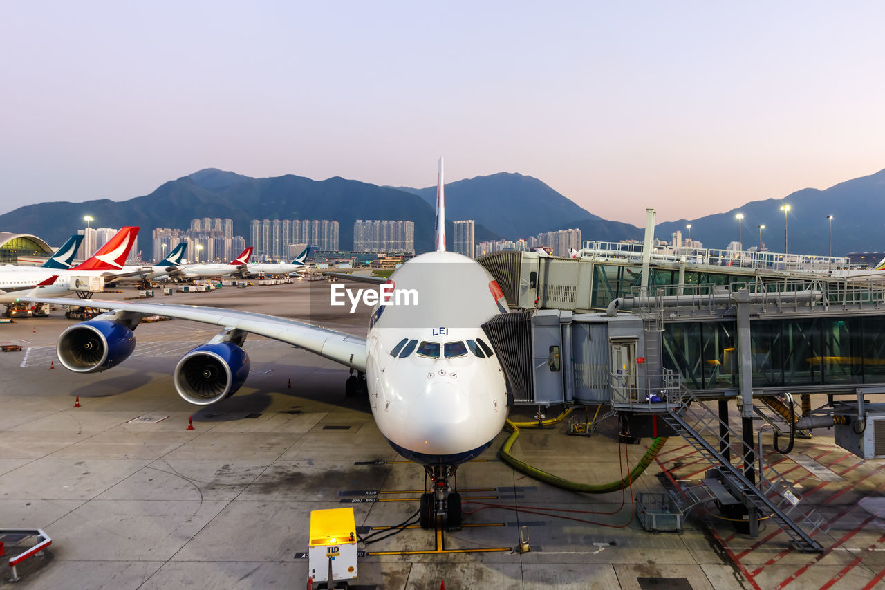 AIRPLANE ON RUNWAY AGAINST SKY