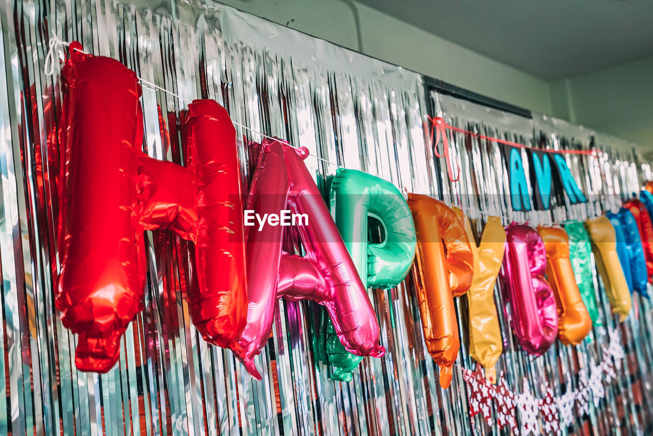 Close-up of birthday decoration on wall