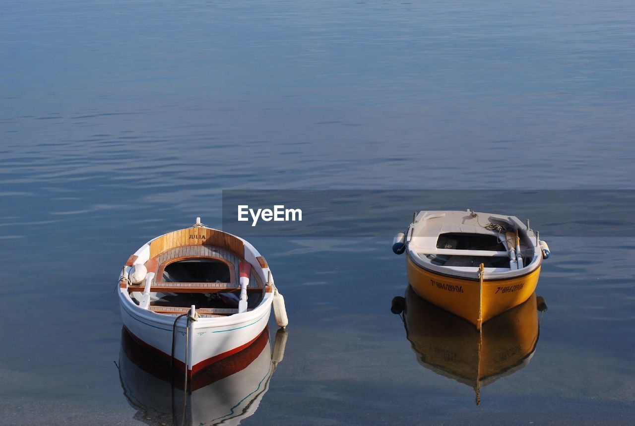 BOATS MOORED IN WATER