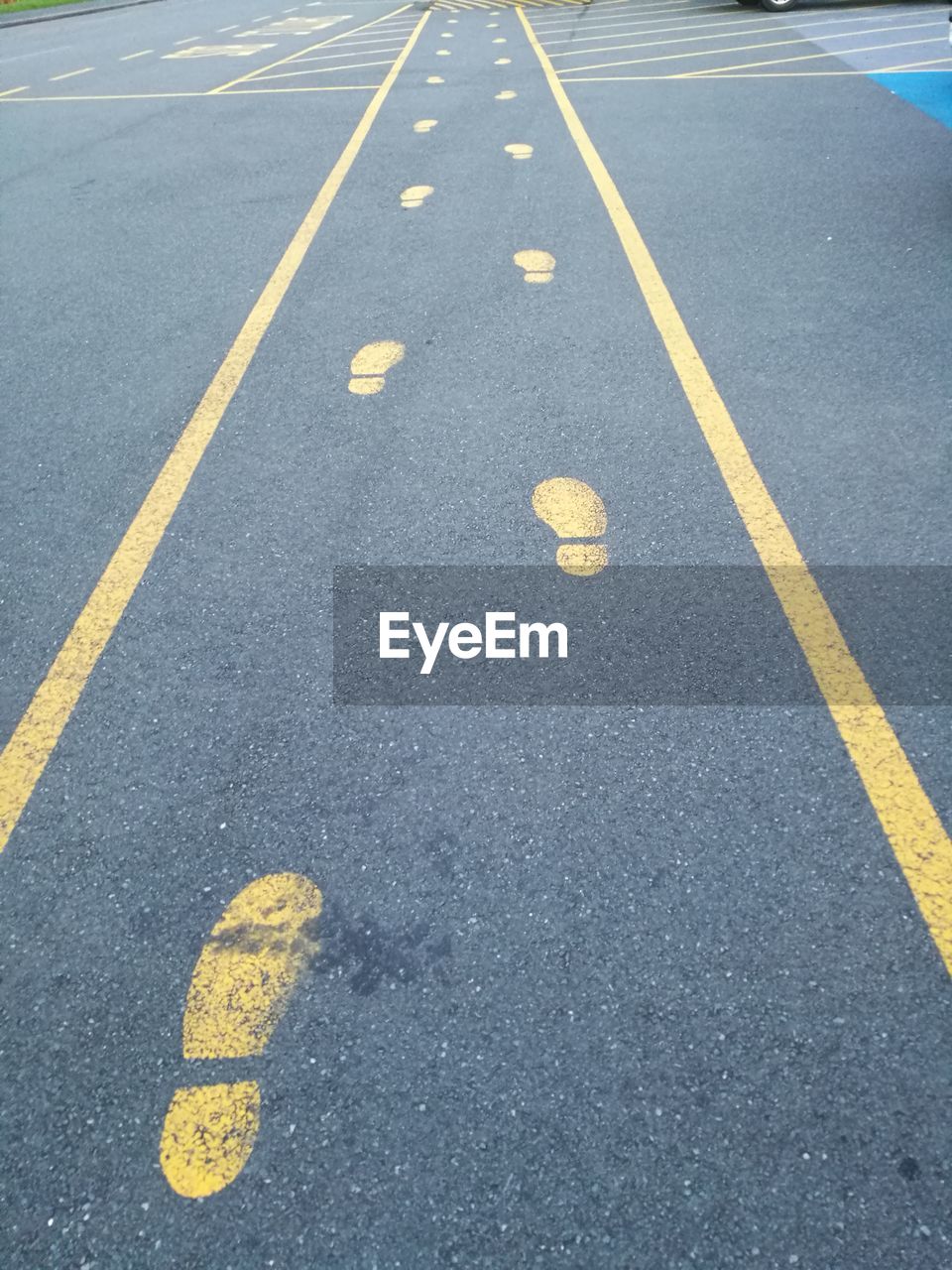 Yellow arrow symbol on road