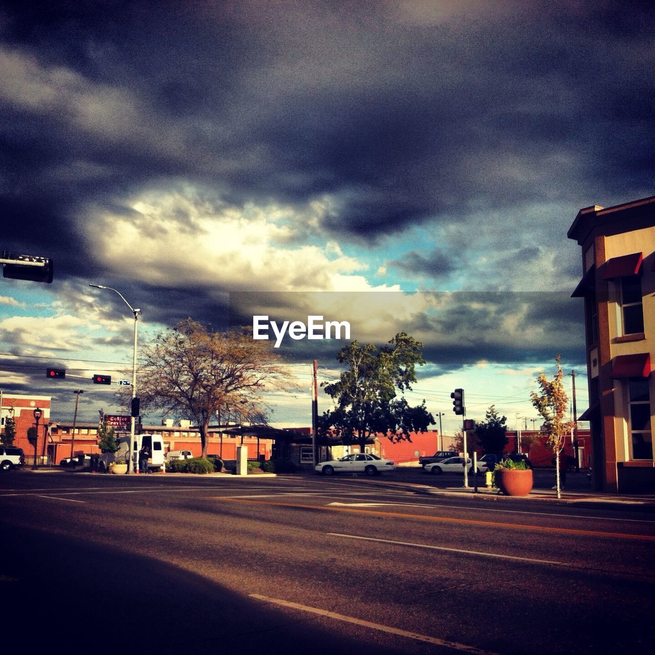 City street against cloudy sky