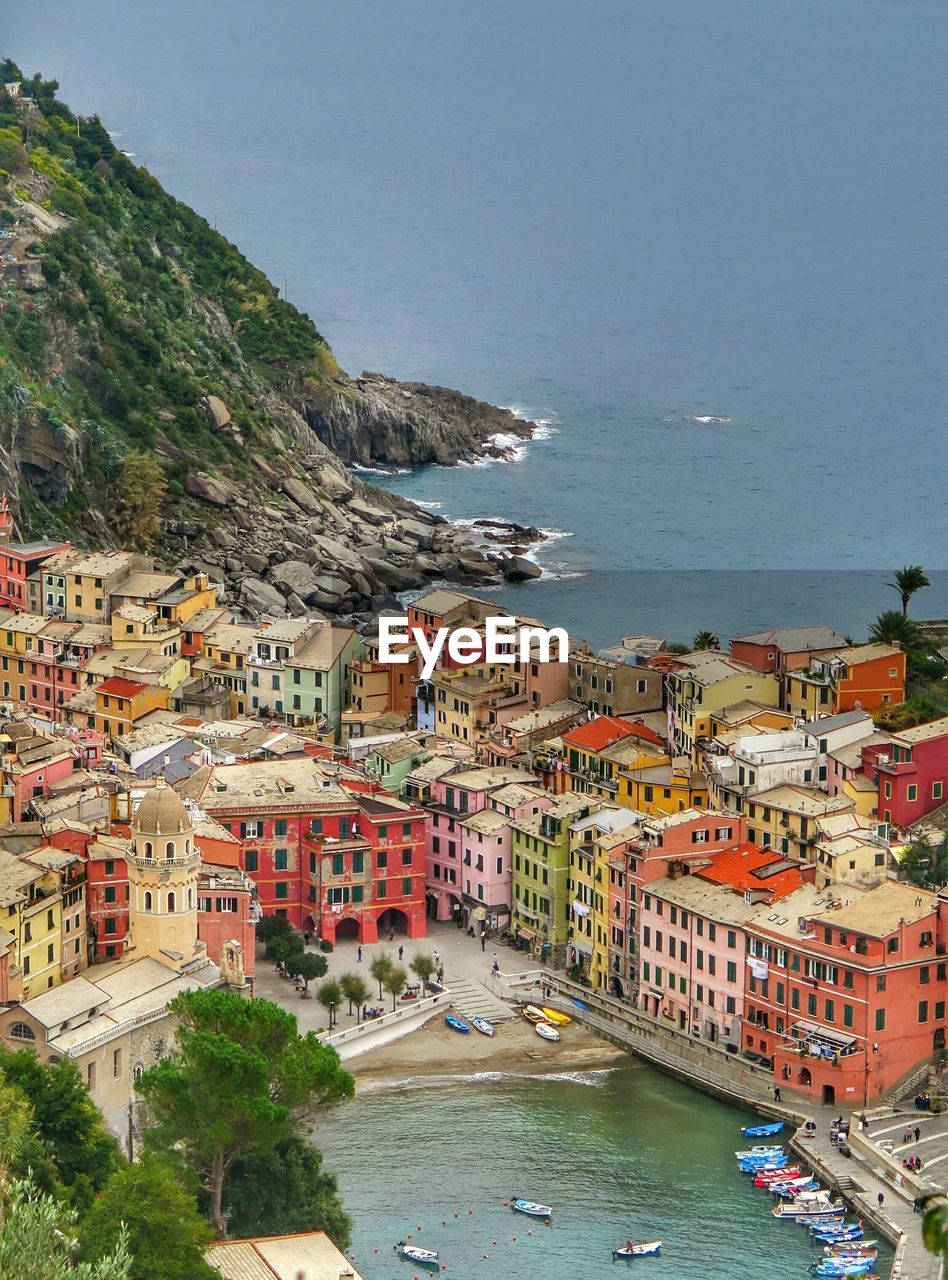 High angle view of town by sea at cinque terre