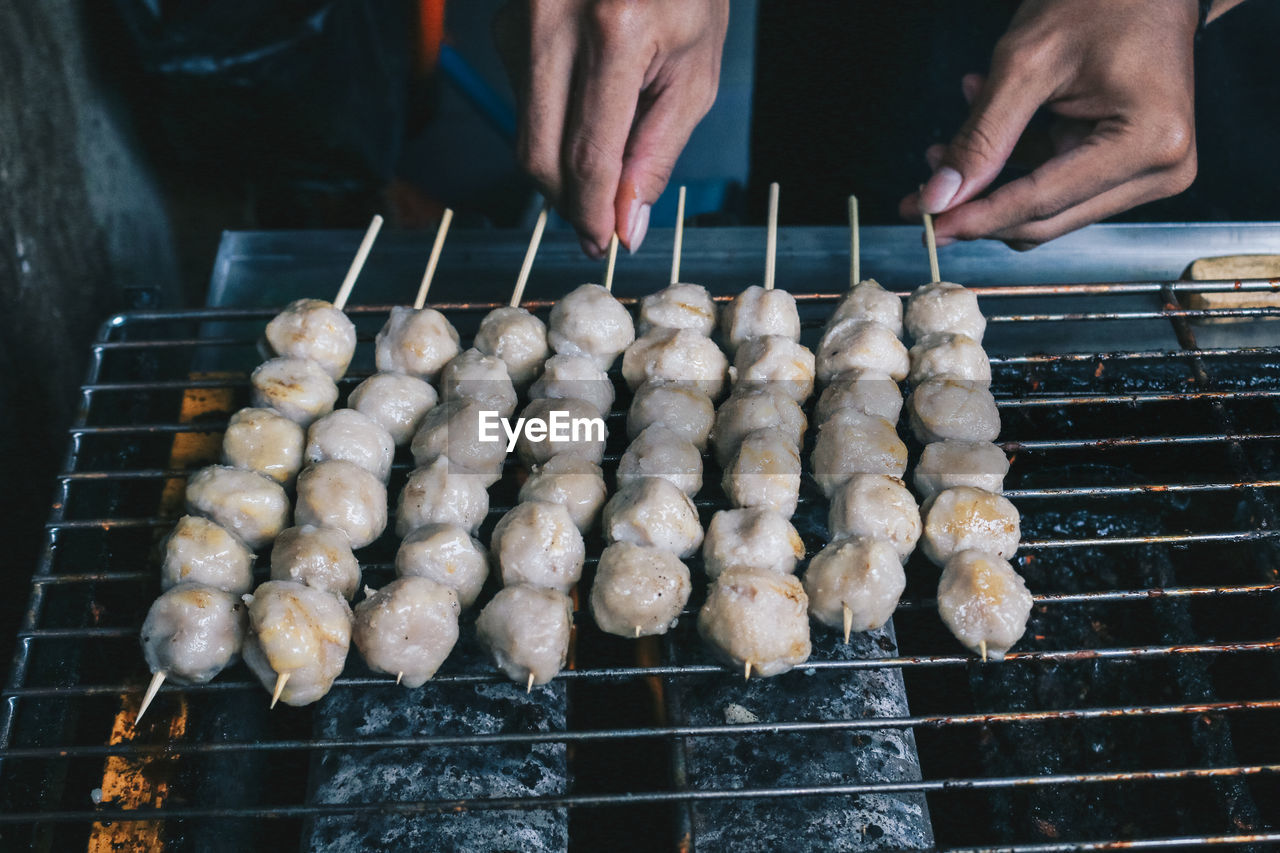 HIGH ANGLE VIEW OF PERSON PREPARING FOOD