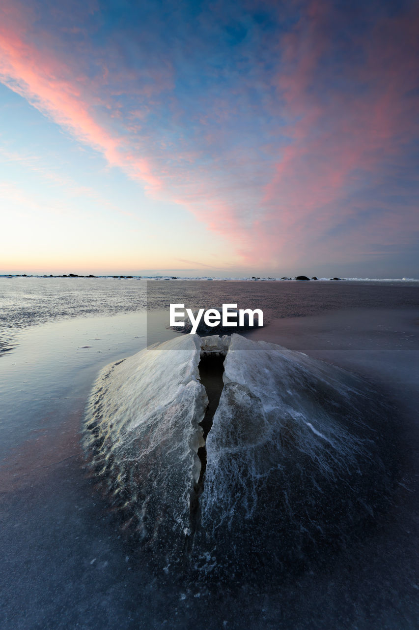 Frozen rocks in the water of näsbokrok nature reserve, halland, sweden, europe