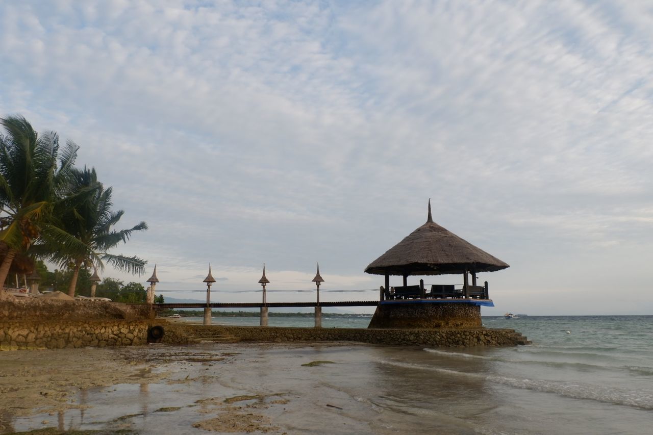 GAZEBO ON BEACH AGAINST SKY