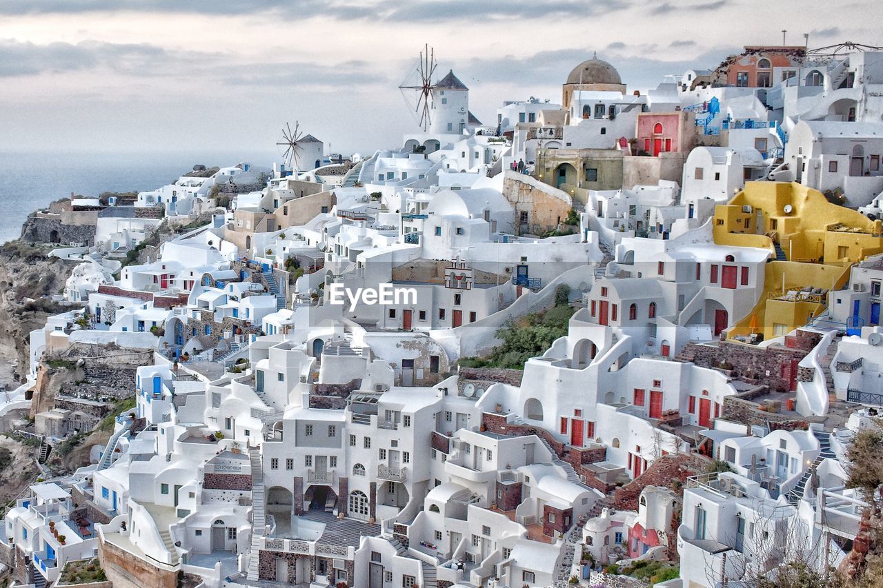 High angle view of townscape by sea against sky. oia, santorini 