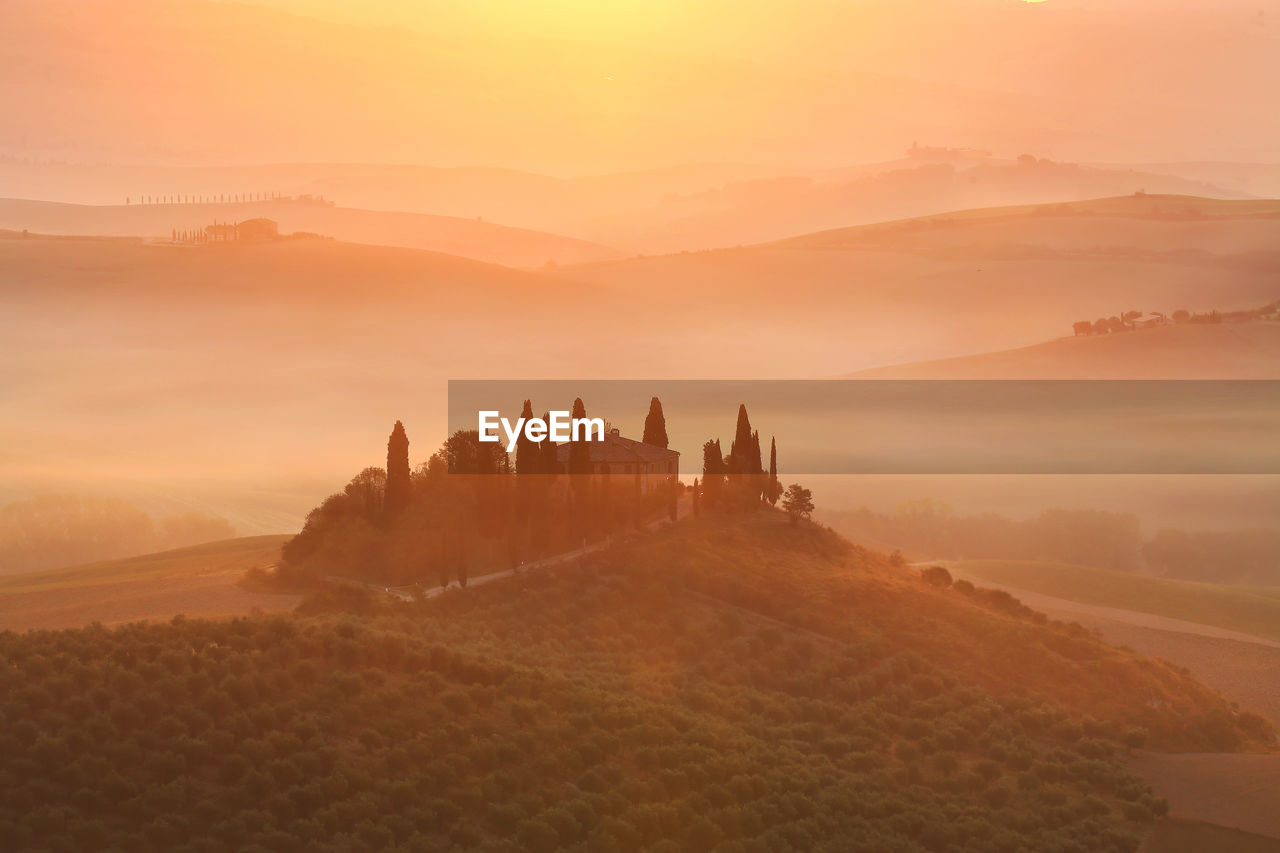 Scenic view of mountains against sky during sunset