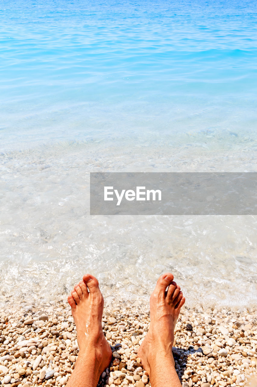 Low section of person on beach