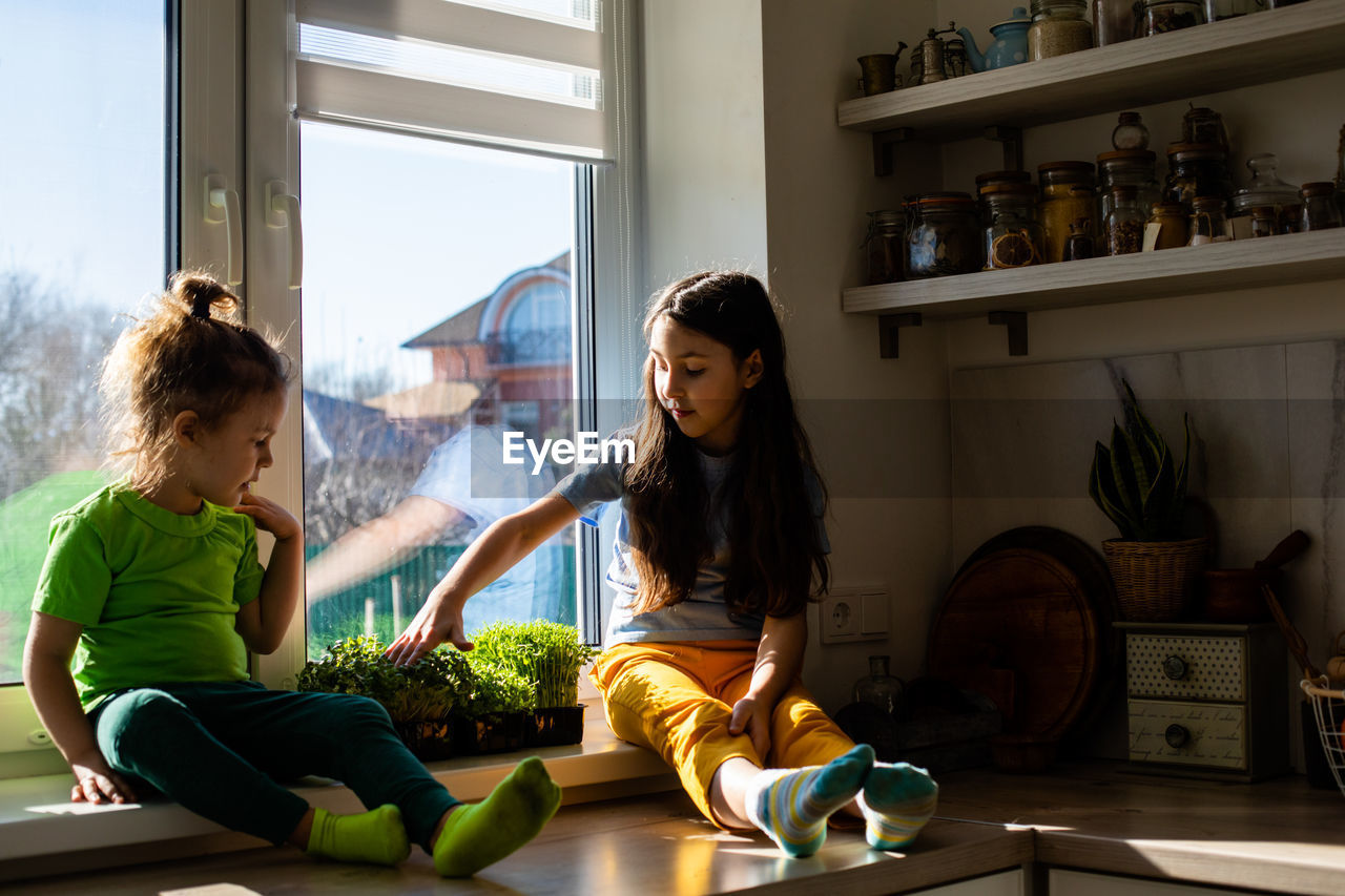 Woman and daughter at home