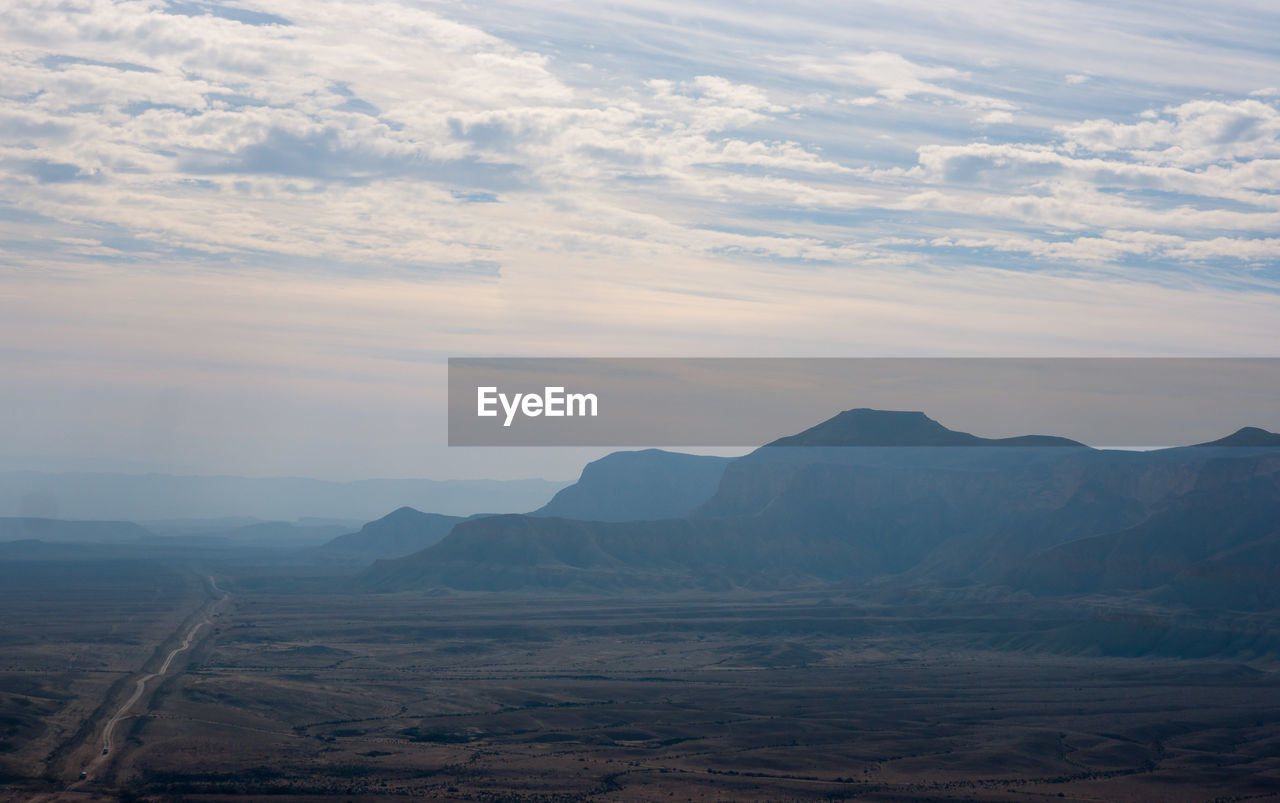 View of landscape against cloudy sky