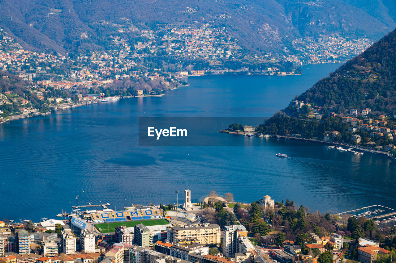The city of como, the lake, the lakeside promenade, the buildings, photographed from above.