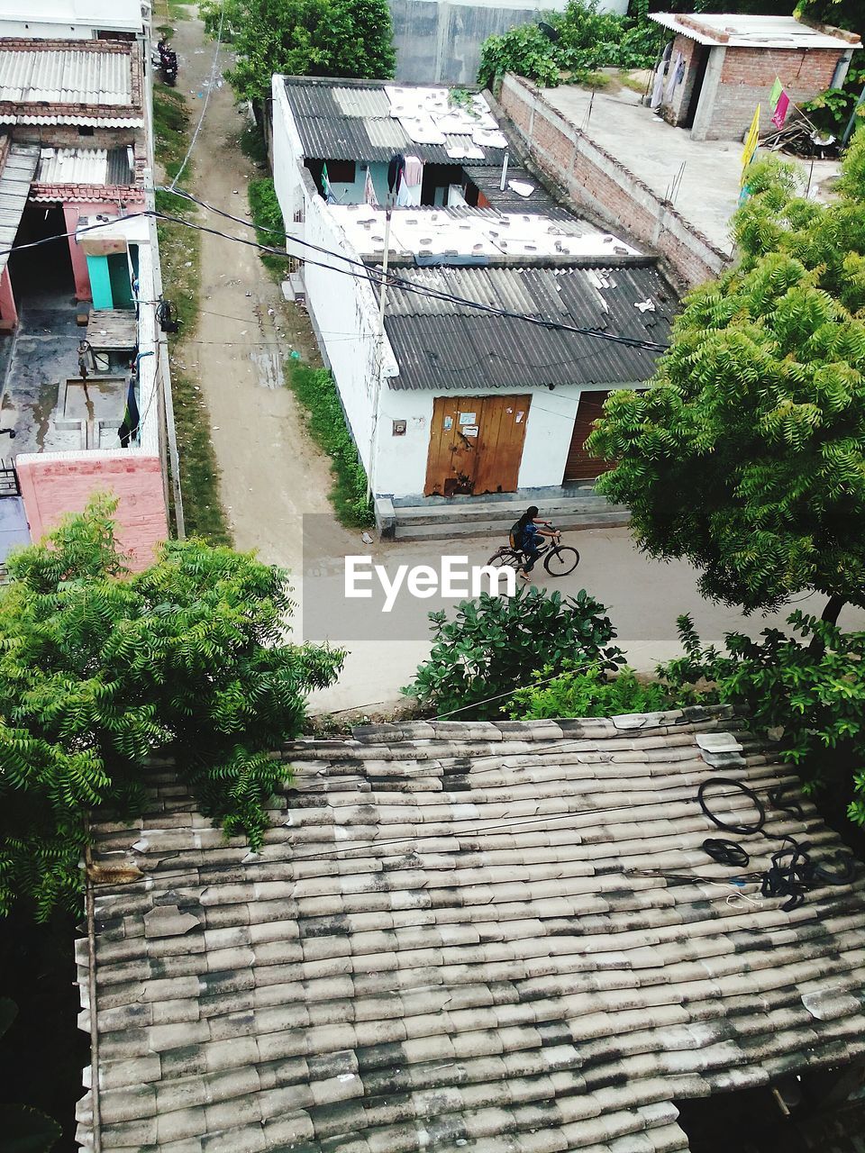 High angle view of road amidst houses in town