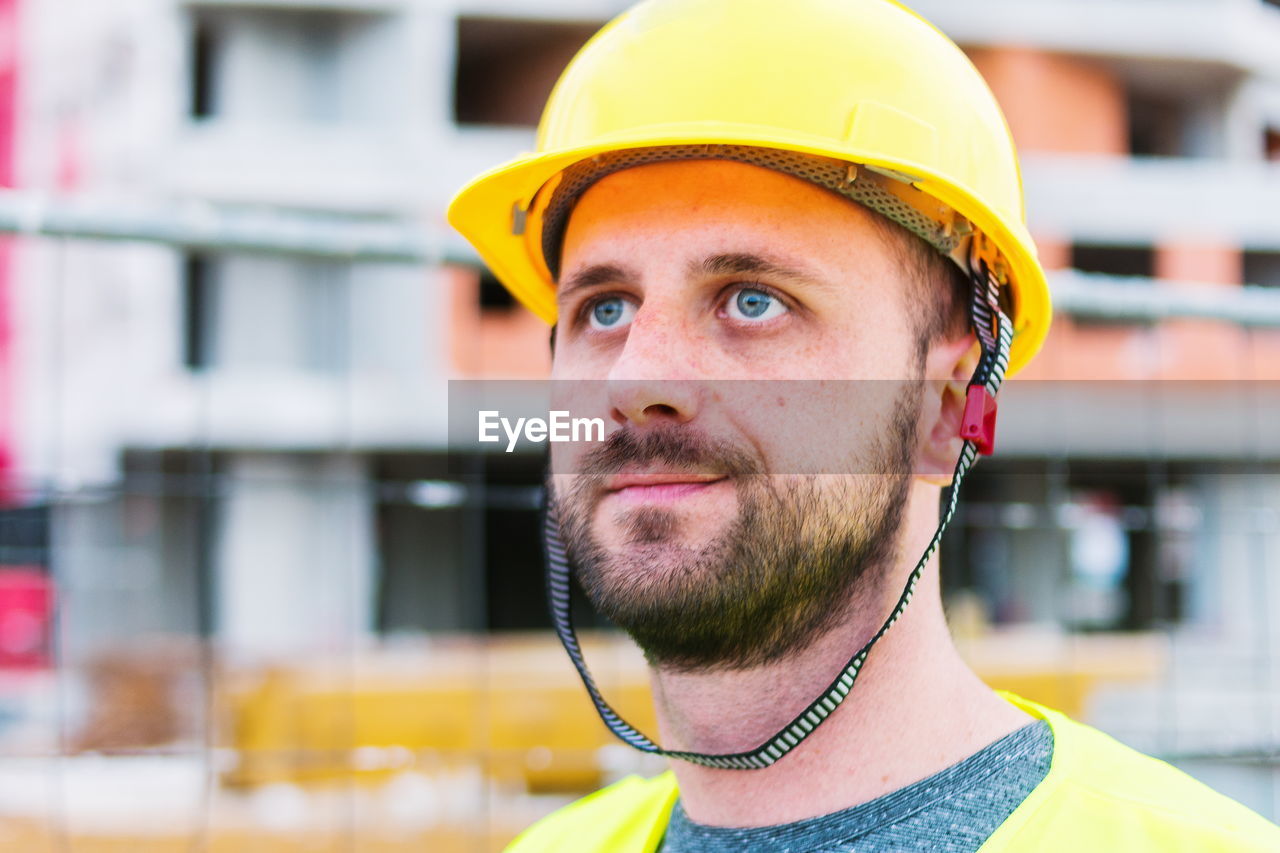 Close-up of construction worker looking away