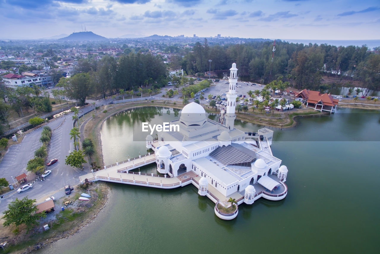 High angle view of tengku tengah zaharah mosque in lake against sky