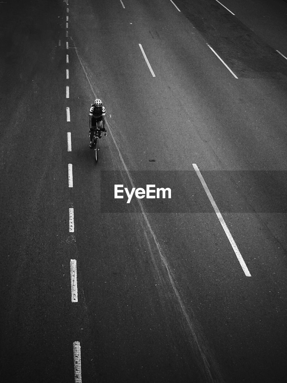 High angle view of person cycling on road