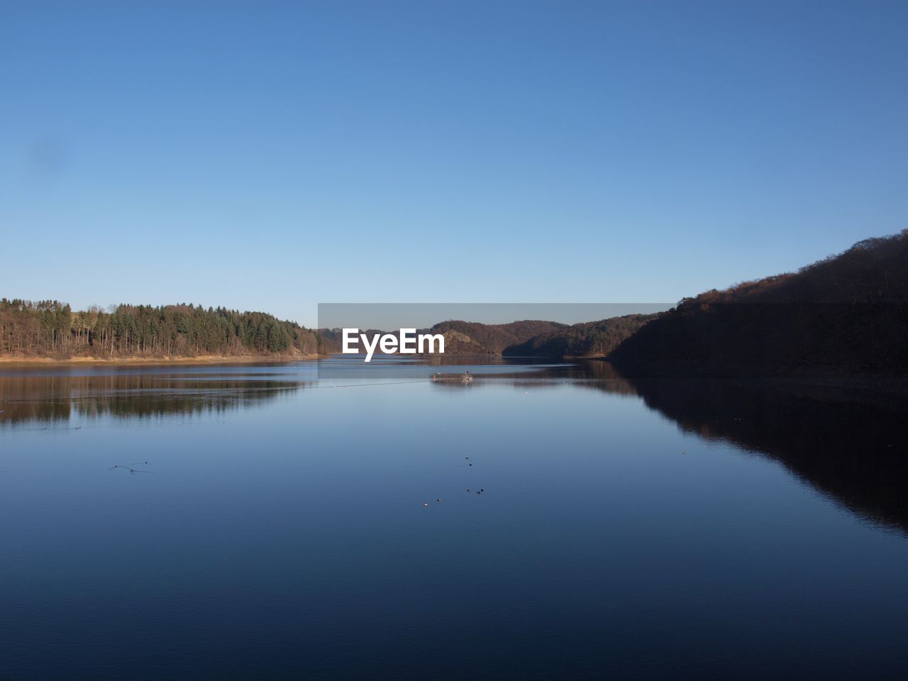 Scenic view of landscape against clear blue sky