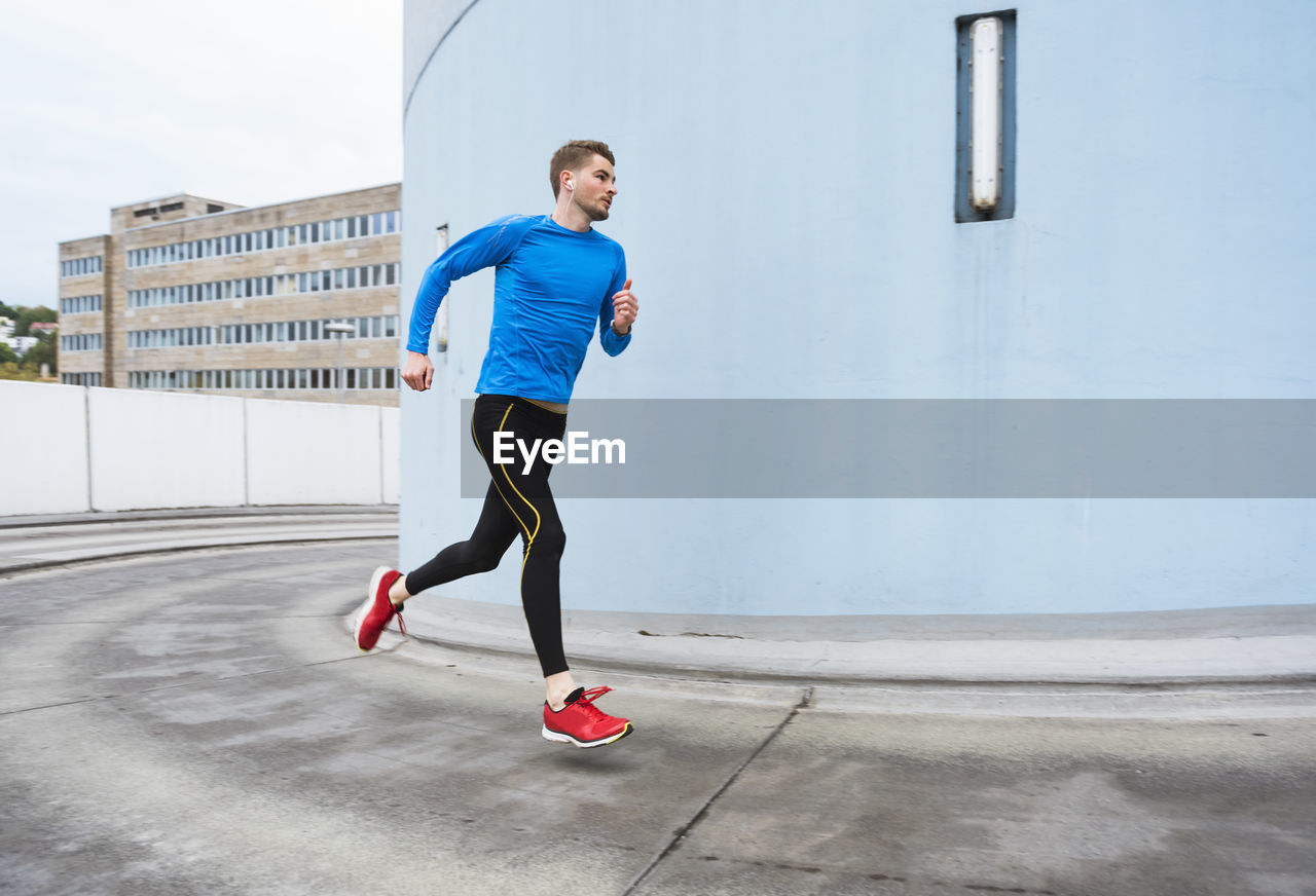 Young man running in the city